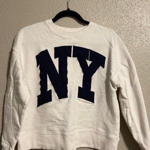 Zara white Sweater with NY blue letters. Size M